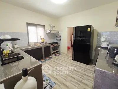 Spacious kitchen with modern appliances and ample counter space.