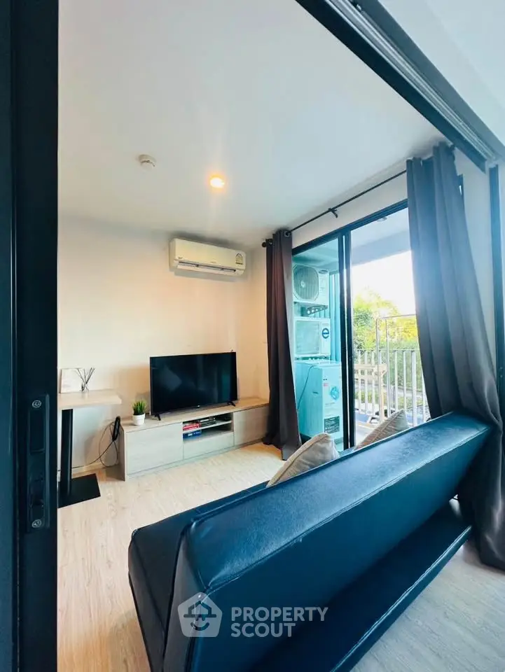 Modern living room with balcony view and sleek furniture