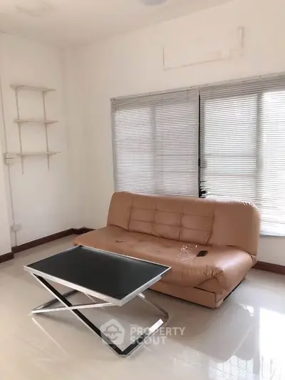 Modern living room with sleek sofa and stylish coffee table