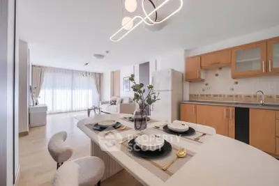 Modern open-layout kitchen and living room with stylish decor and natural light
