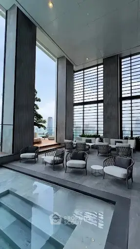 Luxurious rooftop pool area with modern seating and stunning city views.