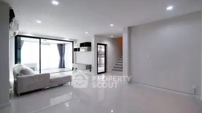 Spacious modern living room with sleek design and natural light