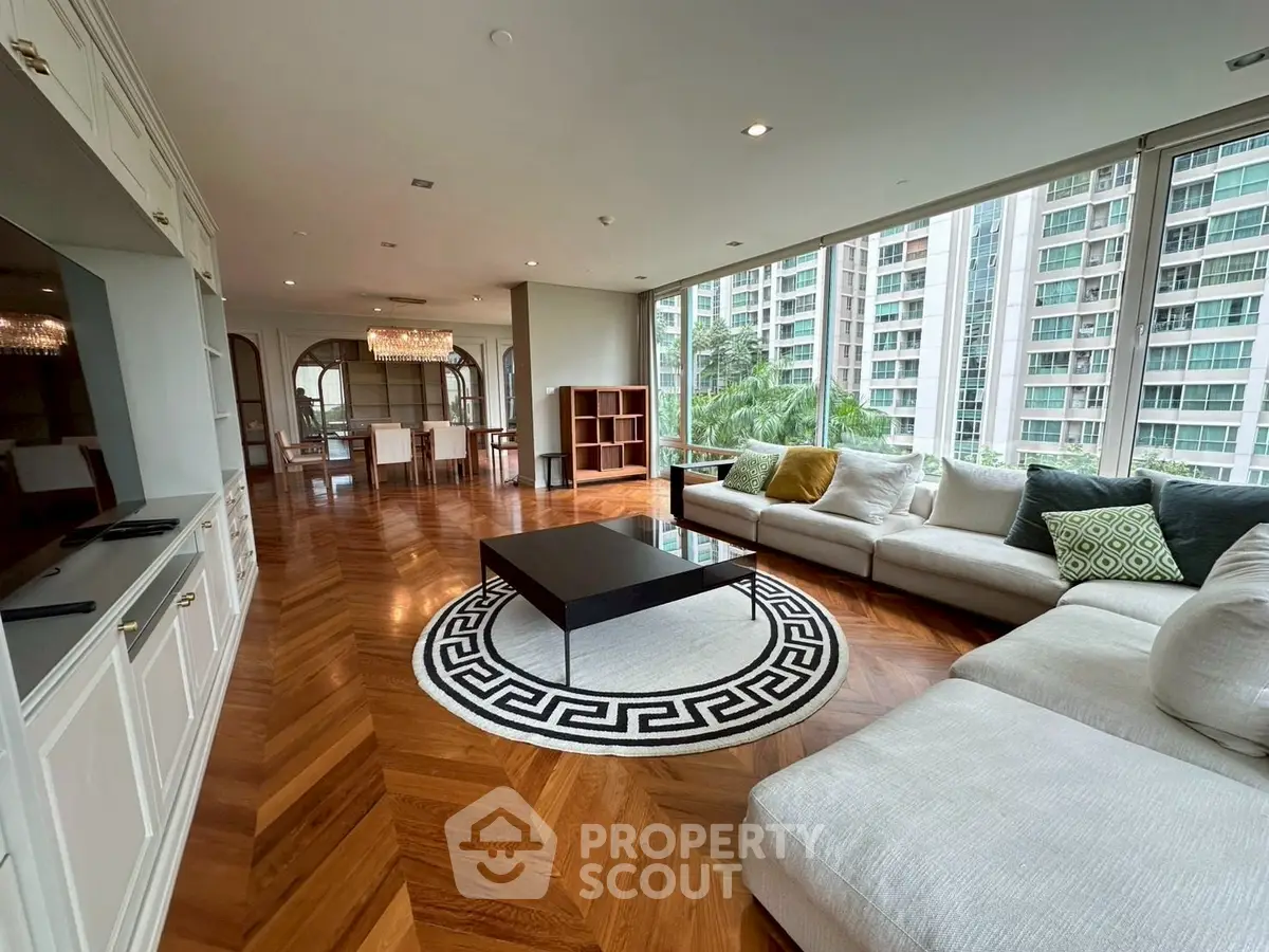 Luxurious living room with elegant parquet flooring and panoramic city views.