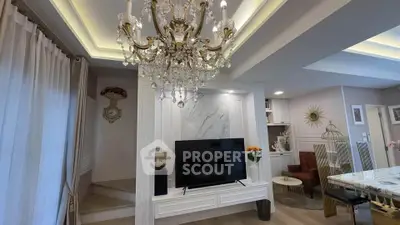 Luxurious living room with elegant chandelier and modern decor