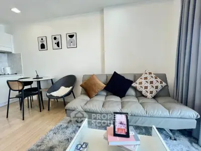 Modern living room with stylish decor and cozy seating area in a contemporary apartment.