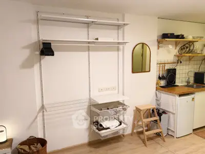Modern kitchen with open shelving and compact storage solutions