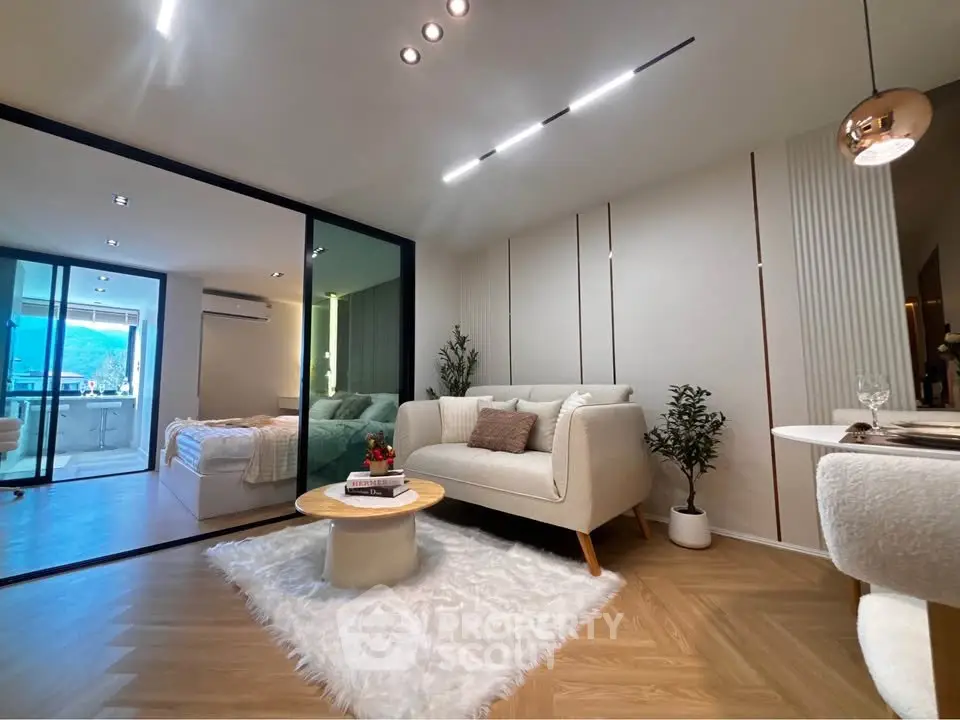 Modern living room with cozy decor and open layout in a stylish apartment.