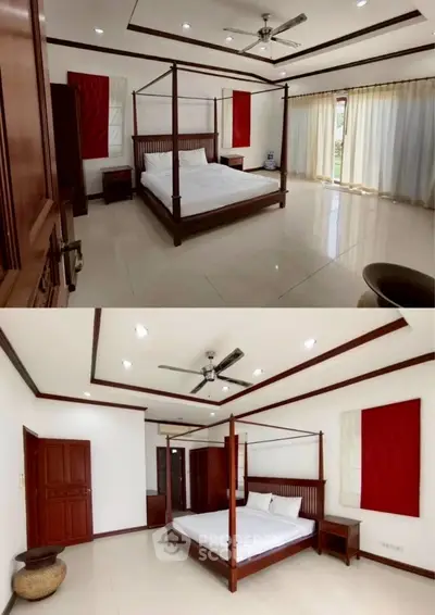 Spacious bedroom with elegant four-poster bed and modern ceiling fan.