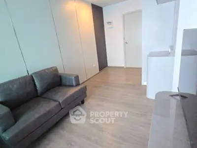Modern living room with sleek design and comfortable sofa in a stylish apartment.