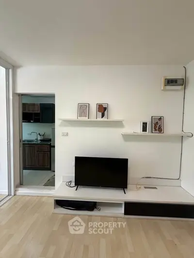 Modern living room with minimalist decor and open kitchen layout