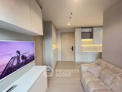 Modern living room with sleek furniture and ambient lighting in a stylish apartment.
