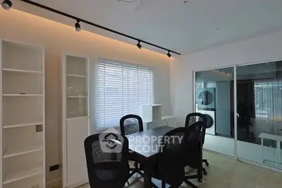 Modern study room with sleek furniture and ample natural light