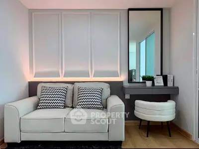 Modern living room with stylish sofa and chic decor, perfect for urban living.
