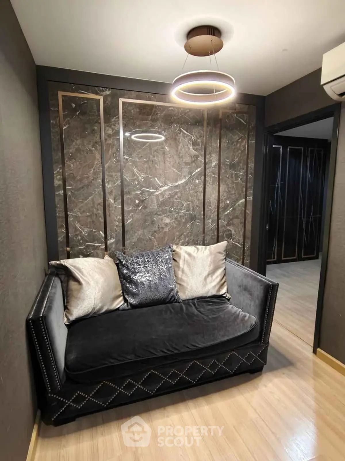 Luxurious small living area with elegant sofa and modern lighting