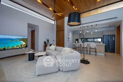 Luxurious open-plan living room with modern kitchen and stylish decor