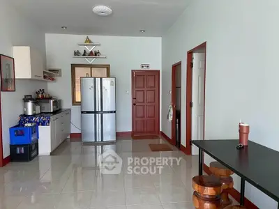 Spacious kitchen with modern appliances and ample storage in a cozy home setting.