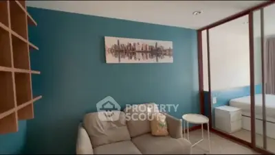 Modern living room with stylish decor and comfortable seating in a cozy apartment.