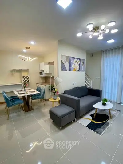 Modern open-plan living room with stylish decor and dining area
