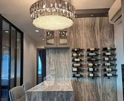 Luxurious modern kitchen with elegant wine rack and chandelier