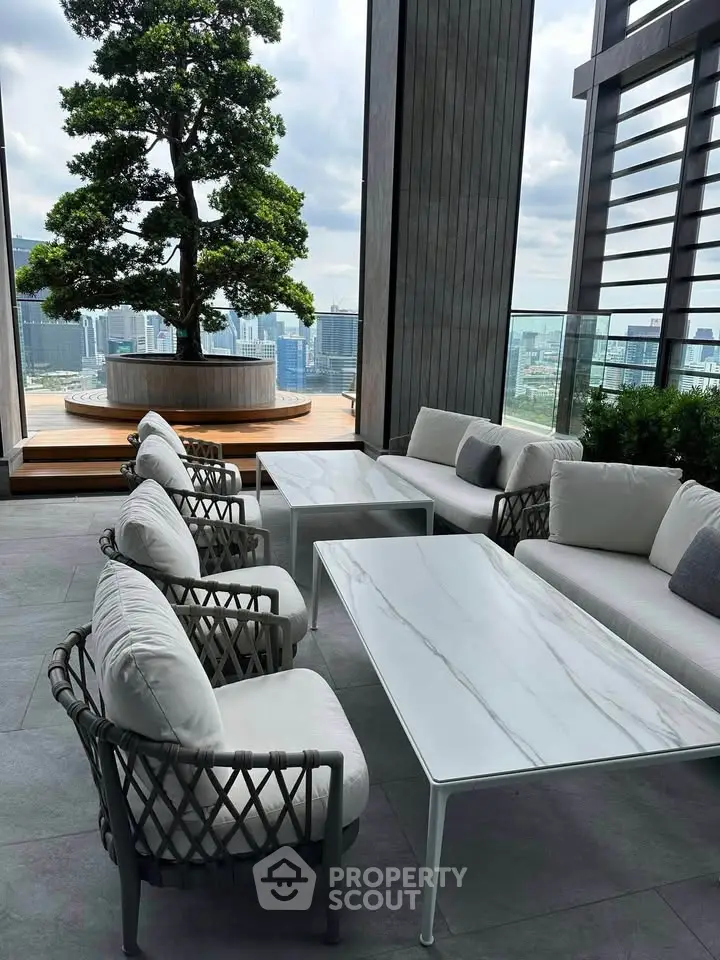 Luxurious rooftop terrace with stunning city views and elegant outdoor seating area.