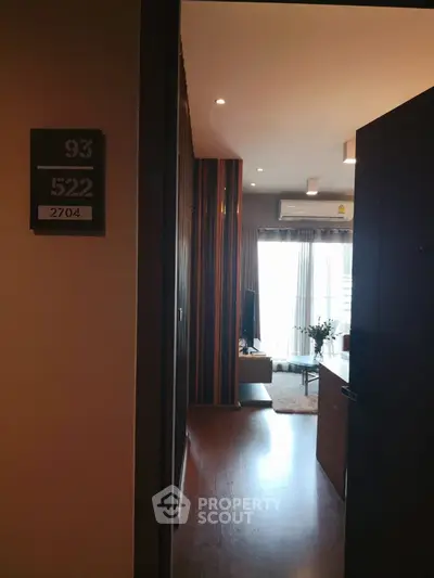 Stylish modern living room with wooden flooring and natural light