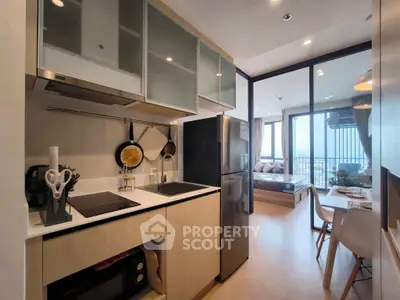 Modern open kitchen with sleek appliances and cozy dining area