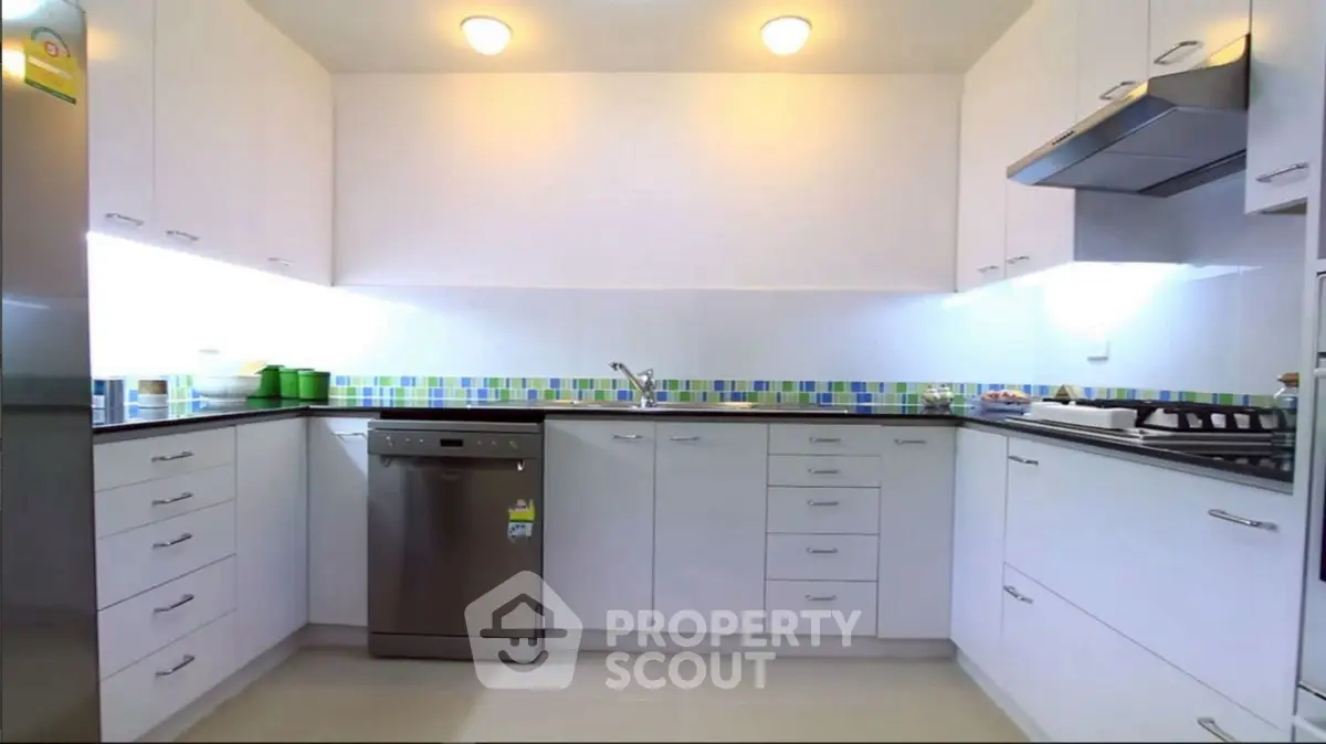 Modern kitchen with sleek cabinetry and stainless steel appliances