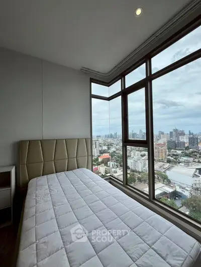 Stunning bedroom with panoramic city view in modern high-rise apartment