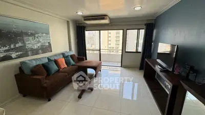 Spacious living room with city view and modern furnishings