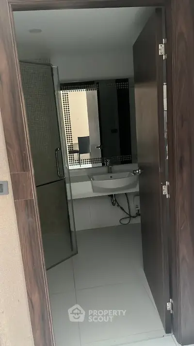 Modern bathroom with sleek design and glass shower enclosure