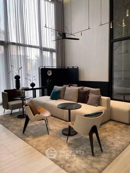 Luxurious modern living room with high ceilings and elegant furniture