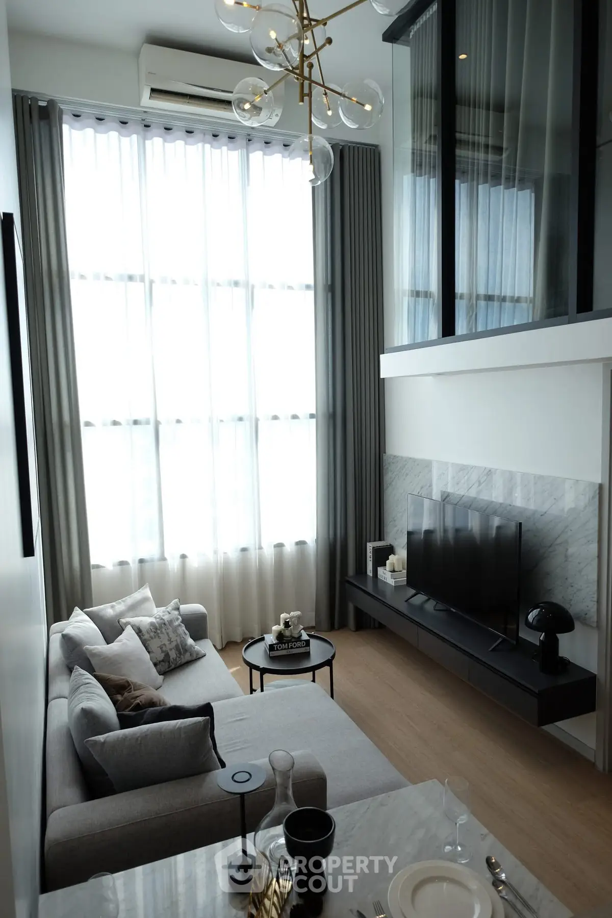 Modern living room with high ceilings and stylish decor