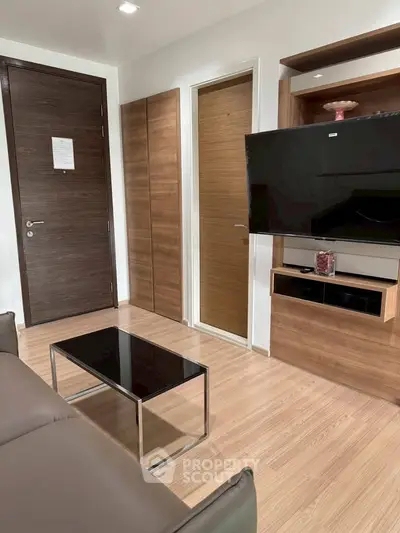 Modern living room with sleek wooden finishes and wall-mounted TV