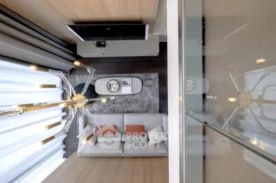 Modern living room with elegant chandelier and cozy sofa