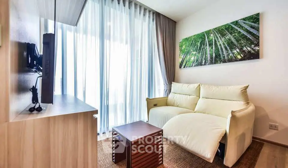 Modern living room with cozy sofa and large window in stylish apartment