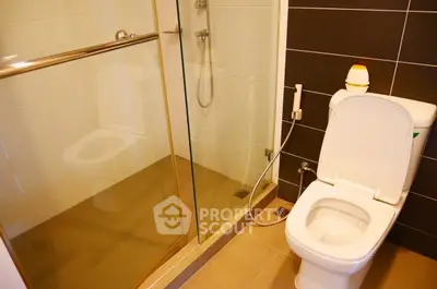 Modern bathroom with glass shower and sleek toilet design