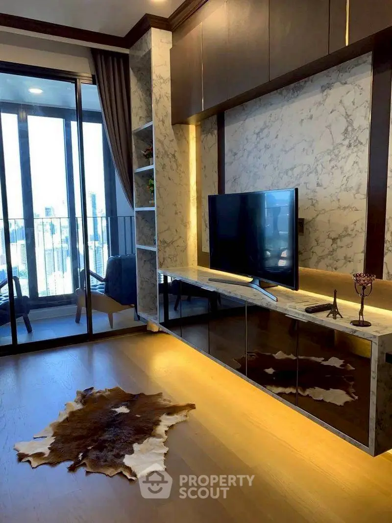 Luxurious living room with marble accents and city view balcony