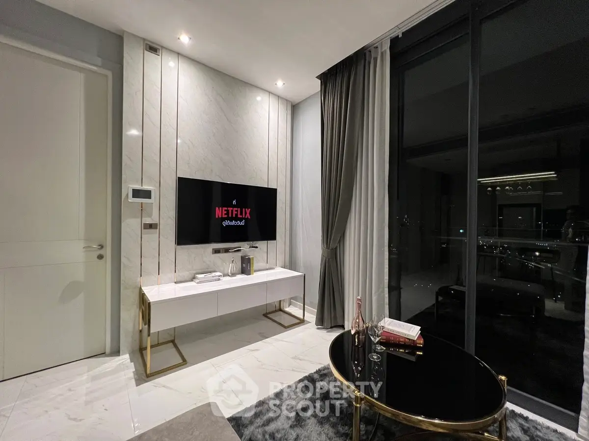 Luxurious modern living room with marble accents and city view balcony.