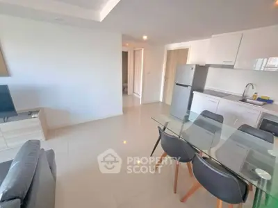 Modern open-plan living room with sleek kitchen and dining area