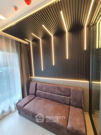 Modern living room with stylish lighting and plush sofa in contemporary apartment