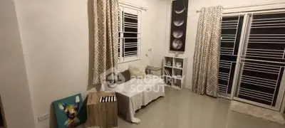 Cozy living room with modern decor and large windows for natural light.