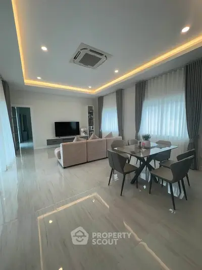 Spacious modern living room with elegant dining area and stylish decor