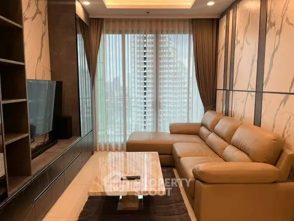 Luxurious living room with modern leather sofa and marble accents, offering a sophisticated urban view.