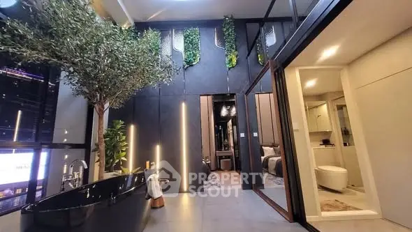 Luxurious modern bathroom with black bathtub and vertical garden