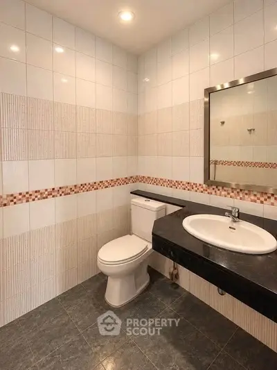 Modern bathroom with sleek fixtures and stylish tile design