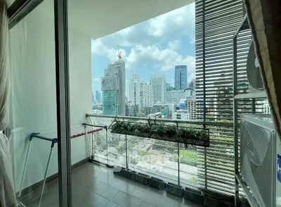 Spacious balcony with stunning city skyline view, perfect for relaxation and enjoying urban living.