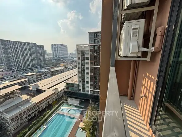 Stunning high-rise view with pool and cityscape, perfect for urban living.