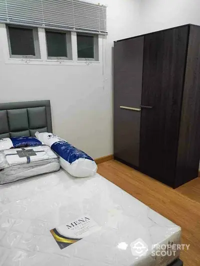 Modern bedroom with stylish wardrobe and comfortable bed setup