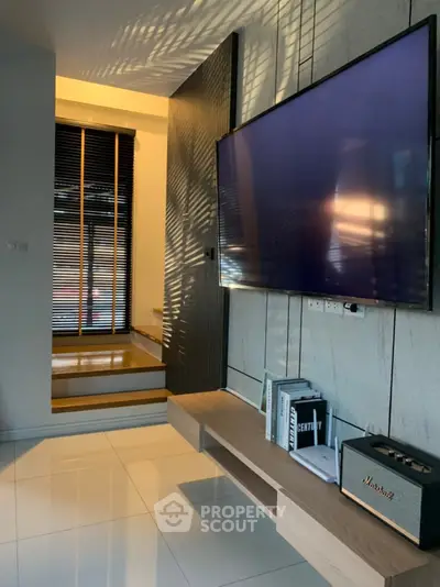 Modern living room with sleek TV setup and stylish decor