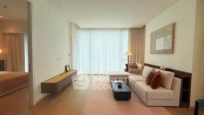Elegant living room with modern decor and large windows in a luxury apartment.